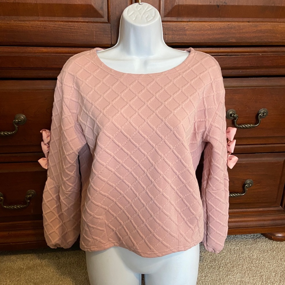 Blush top with ribbon detail on sleeves